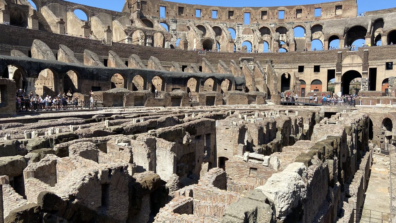 Inside the Colosseum: the exposed hypogeum under the arena floor and the tiered arches above
