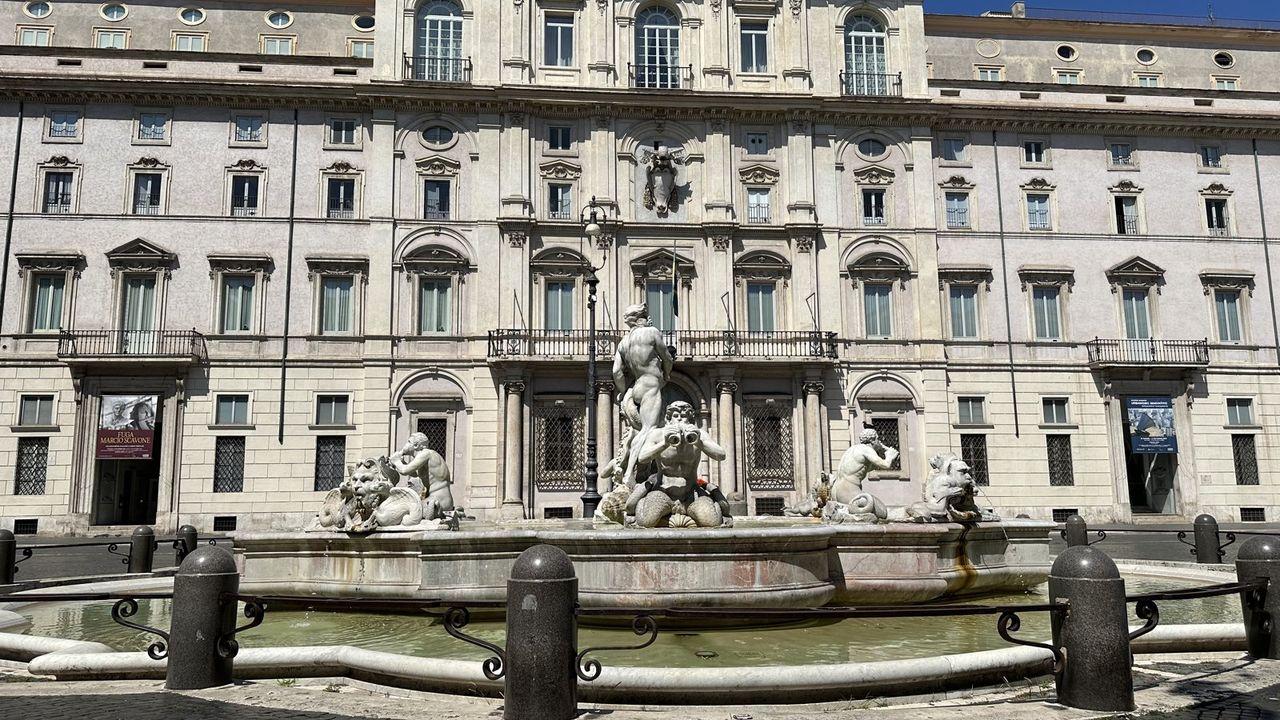 The Fountain of the Moor on Piazza Navona, sculpted figures in the basin, a palazzo facade behind