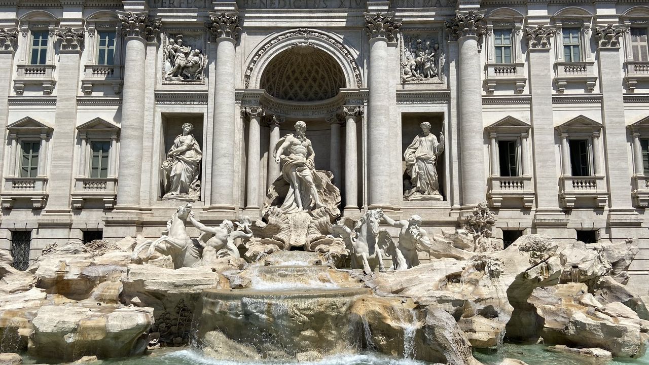 Trevi Fountain, the basin and the sculpted facade, photographed from the piazza