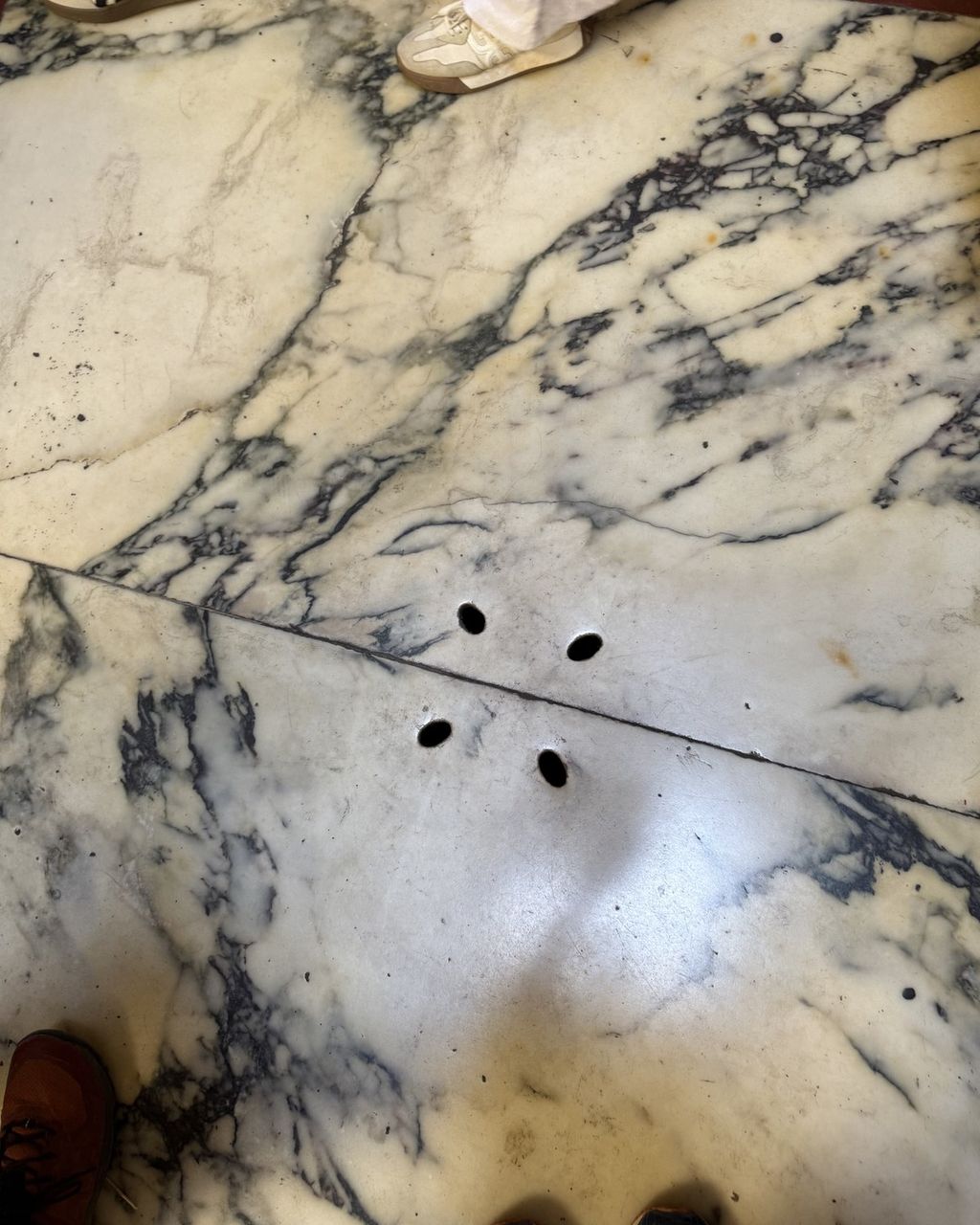 The Pantheon's marble floor with the original drainage holes that carry away rain from the oculus